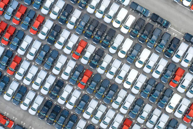 Cars lined up in a parking grid